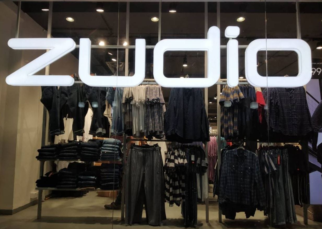 Zudio store front view showcasing brand signage and clothing display inside the store